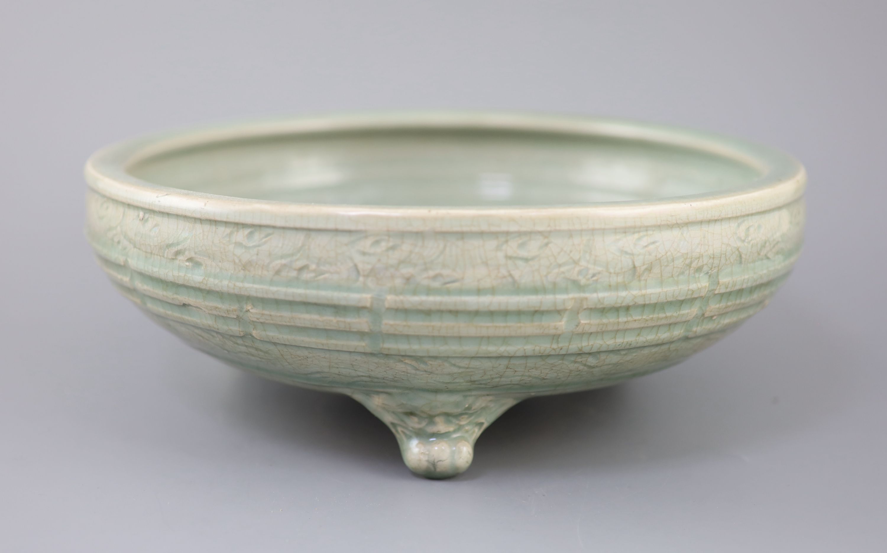 A large Chinese Longquan celadon tripod censer, Ming dynasty, 15th century, 31cm diameter